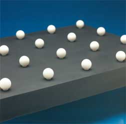 Satin Finished Ceramic Balls on a Flat Black Plate for Optical Evaluation